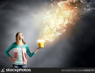 Painting concept. Young girl holding bucket with flying out fume