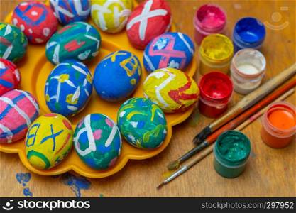 Painting Easter eggs with paints and a brush