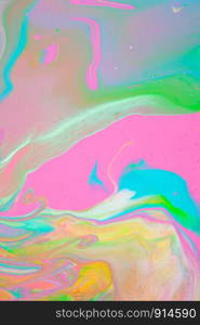 Painting in bright pastel colors using liquid fluid art trendy technique. Flat lay. Close-up. Concept contemporary art accessible to everyone. Vertical.