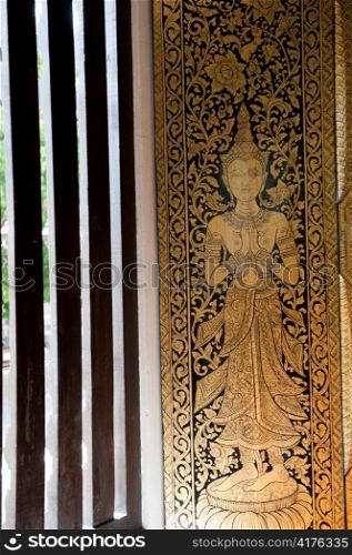 Painting on the window in Wat Phra Singh, Chiang Mai, Thailand