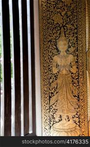 Painting on the window in Wat Phra Singh, Chiang Mai, Thailand
