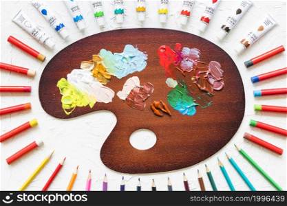 painting palette surrounded by painting material