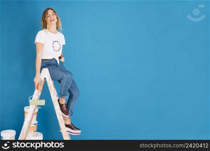 painting scene with girl blue wall