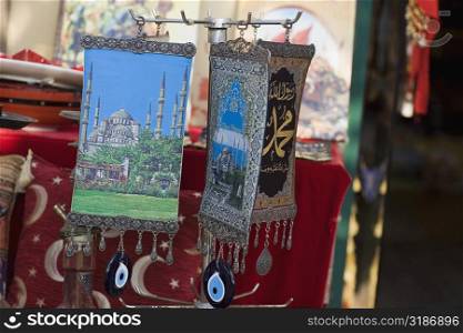Paintings of mosques hanging at a market stall, Istanbul, Turkey
