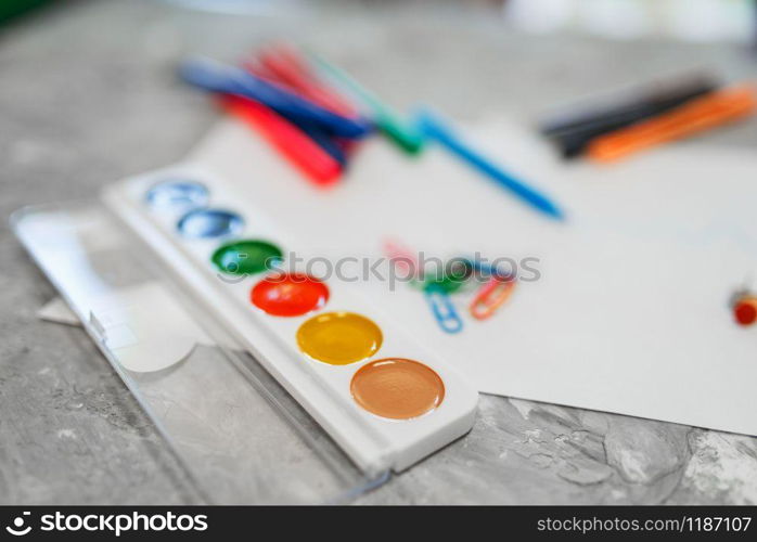 Paints and pencils on the table in stationery store, nobody. assortment in shop, accessories for drawing and writing, school equipment. Paints and pencils on the table, stationery store