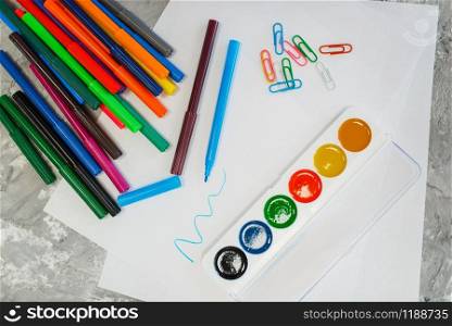 Paints and pencils on the table in stationery store, nobody. assortment in shop, accessories for drawing and writing, school equipment. Paints and pencils on the table, stationery store