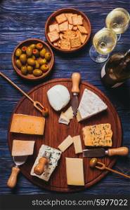 Pair have a nice evening with cheese plate and wine. The Cheese plate