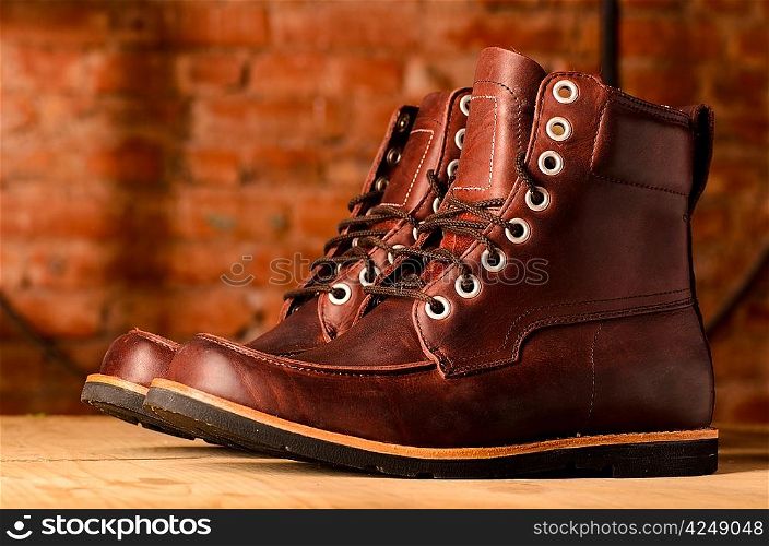 pair of brown leather walking winter boots