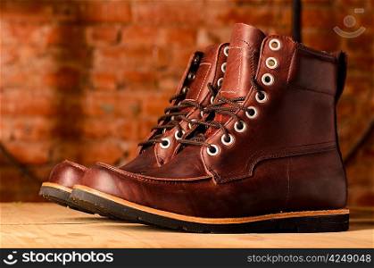 pair of brown leather walking winter boots