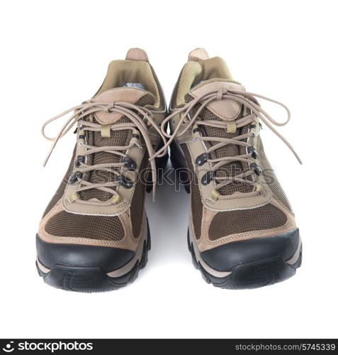 Pair of brown trainers on white isolated background