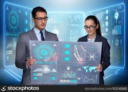 Pair of businessman and businesswoman discussing data