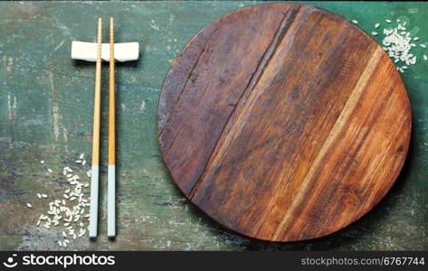 pair of chopsticks on rustic wooden background