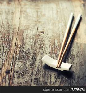 pair of chopsticks on rustic wooden background