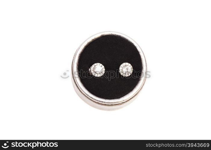 Pair of diamond crystal earrings in silver box isolated on white