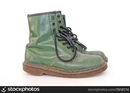 Pair of dirty green worn out shoes