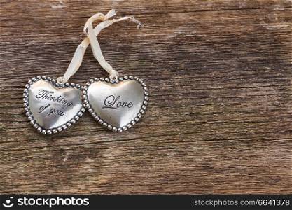 Pair of Love hearts  on wooden background. Love hearts on wood 