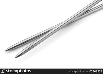 Pair of metal knitting needles isolated on white