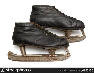 Pair of old ice skates. Isolated objects: pair of very old ice skates, on white background