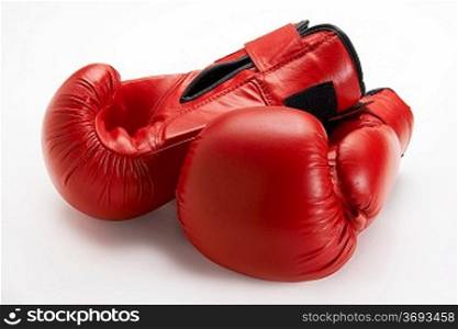 Pair of red boxing gloves isolated on white background