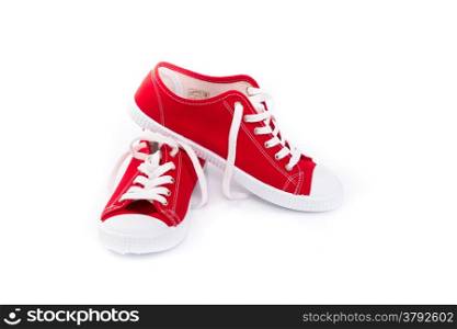 Pair of red shoes on white background