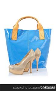 Pair of shoes and bag on white