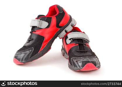 Pair of sports shoes, black and red colors on white background. Isolated.