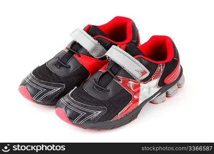 Pair of sports shoes, black and red colors on white background. Isolated.