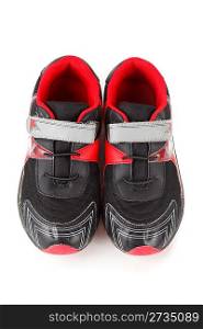 Pair of sports shoes, black and red colors on white background. Isolated. View from above.