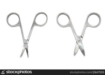 Pair scissors for manicure on a white background