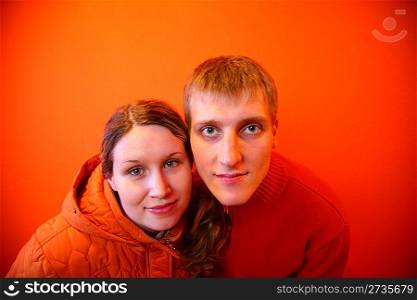 Pair together on an orange background