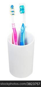 pair tooth brushes in ceramic glass - family set of toothbrushes isolated on white background