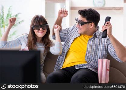 Pair watching 3d movie at home