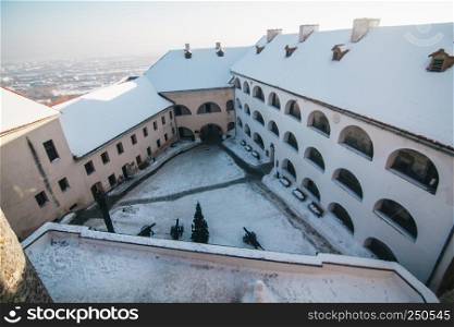 Palanok castle yard layered with snow in Mukachevo, Ukraine