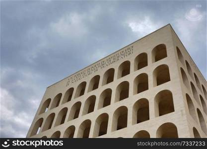 Palazzo della Civilta Italiana  Square Colosseum  in Rome, Italy. The inscription reads   A nation of poets, of artists, of heroes, of saints, of thinkers, of scientists, of navigators, of migrants 