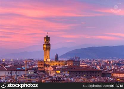 Palazzo Vecchio at sunset in Florence, Italy. Famous Arnolfo tower of Palazzo Vecchio on the Piazza della Signoria at gorgeous sunset from Piazzale Michelangelo in Florence, Tuscany, Italy