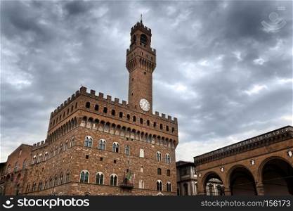 Palazzo Vecchio in Florence, Italy on a cloudy day. Dramatic sky in Italian Firenze. Palazzo Vecchio in Florence, Italy on a cloudy day