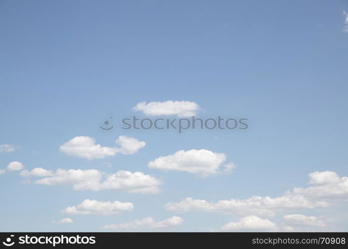 Pale blue sky with clouds - natural background