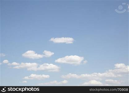 Pale blue sky with clouds - natural background