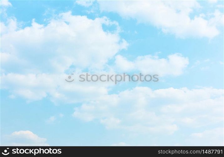 Pale blue sky with white clouds - textured background