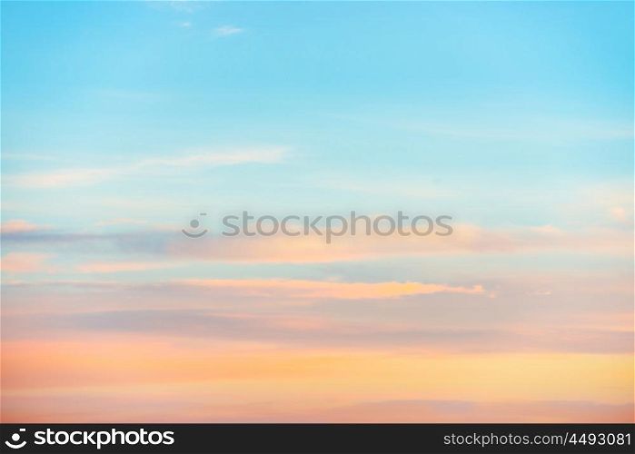 Pale sunset sky with pink, orange and red colors. Natural background