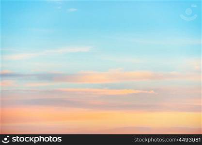 Pale sunset sky with pink, orange and red colors. Natural background