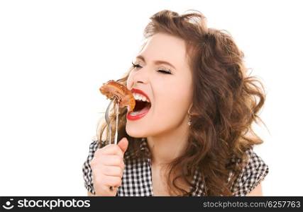 paleo diet concept - young woman eating meat. paleo diet concept - woman eating meat
