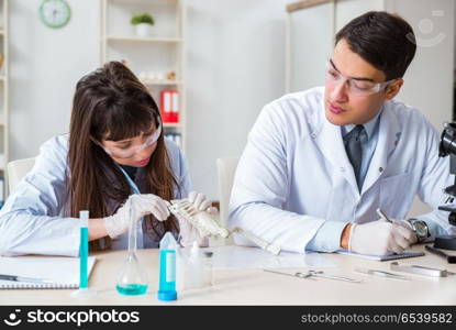 Paleontologists looking at bones of extinct animals