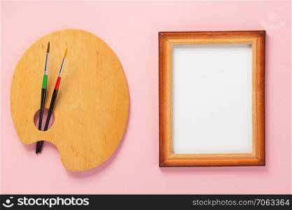 palette and picture frame on abstract background
