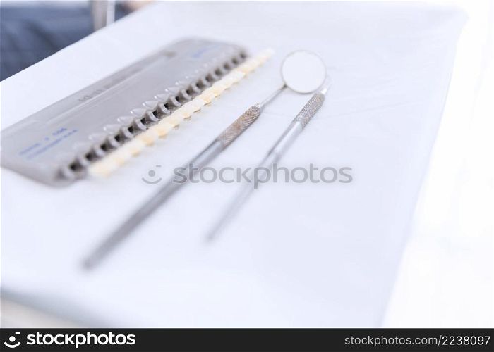 palette teeth shades with dental mirror probe desk