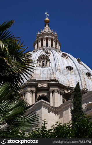 Palm leaves decorate view of dome of St. Peter's Basilica in Rome