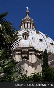 Palm leaves decorate view of dome of St. Peter's Basilica in Rome
