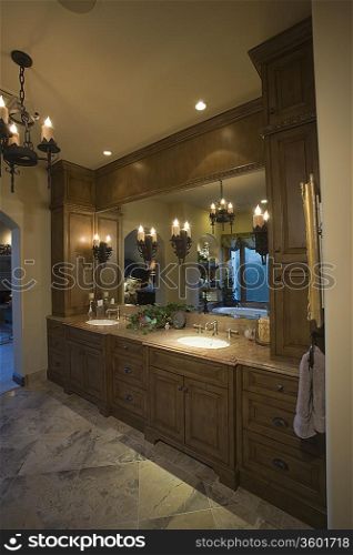 Palm Springs bathroom with lit chandelier