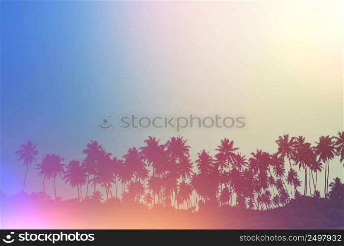 Palm trees on tropical beach, vintage toned and retro film light flare stylized