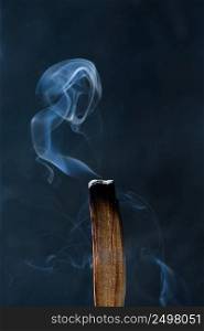 Palo Santo, holy tree stick burning with beautiful aromatic smoke